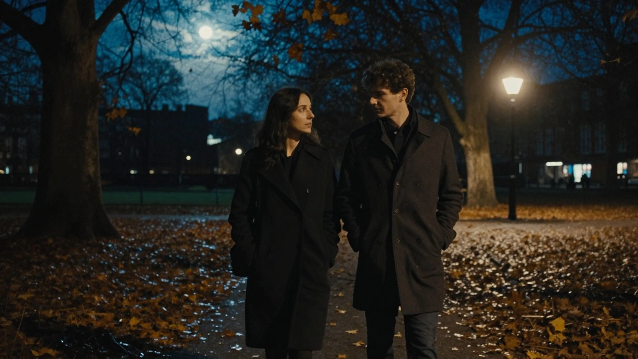 A couple walks in silent harmony through a moonlit London park, autumn leaves swirling around them.